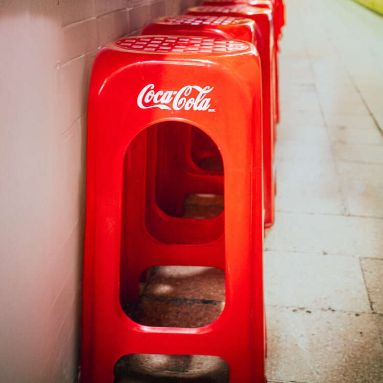 Red Coca Cola stools inside Coyoacán Market in Mexico City CDMX street photography print.