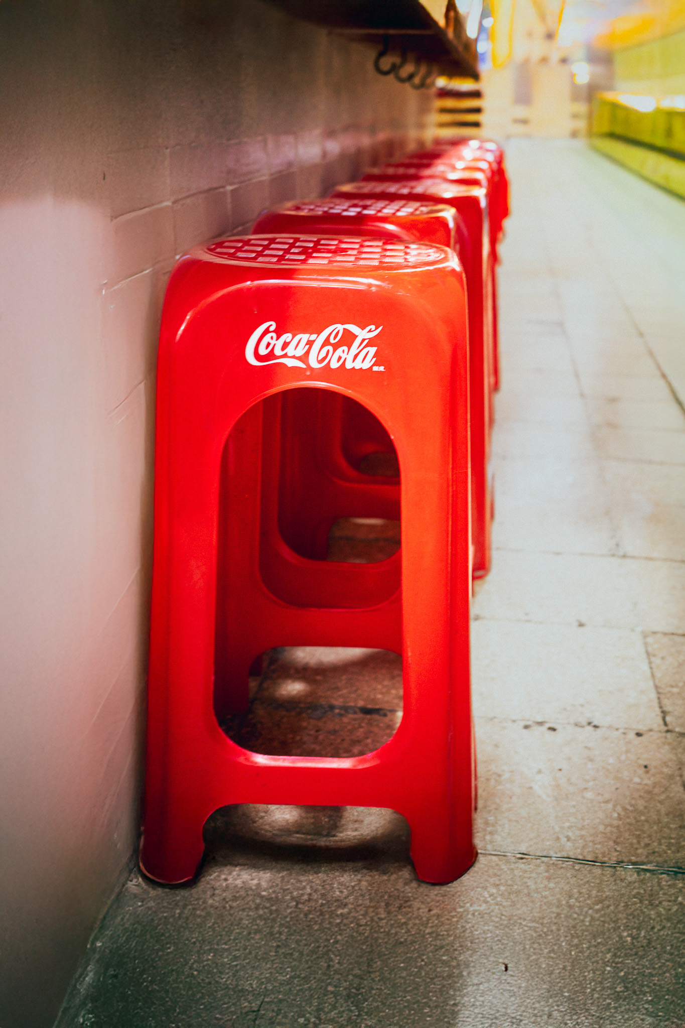 Red Coca Cola stools inside Coyoacán Market in Mexico City CDMX street photography print.